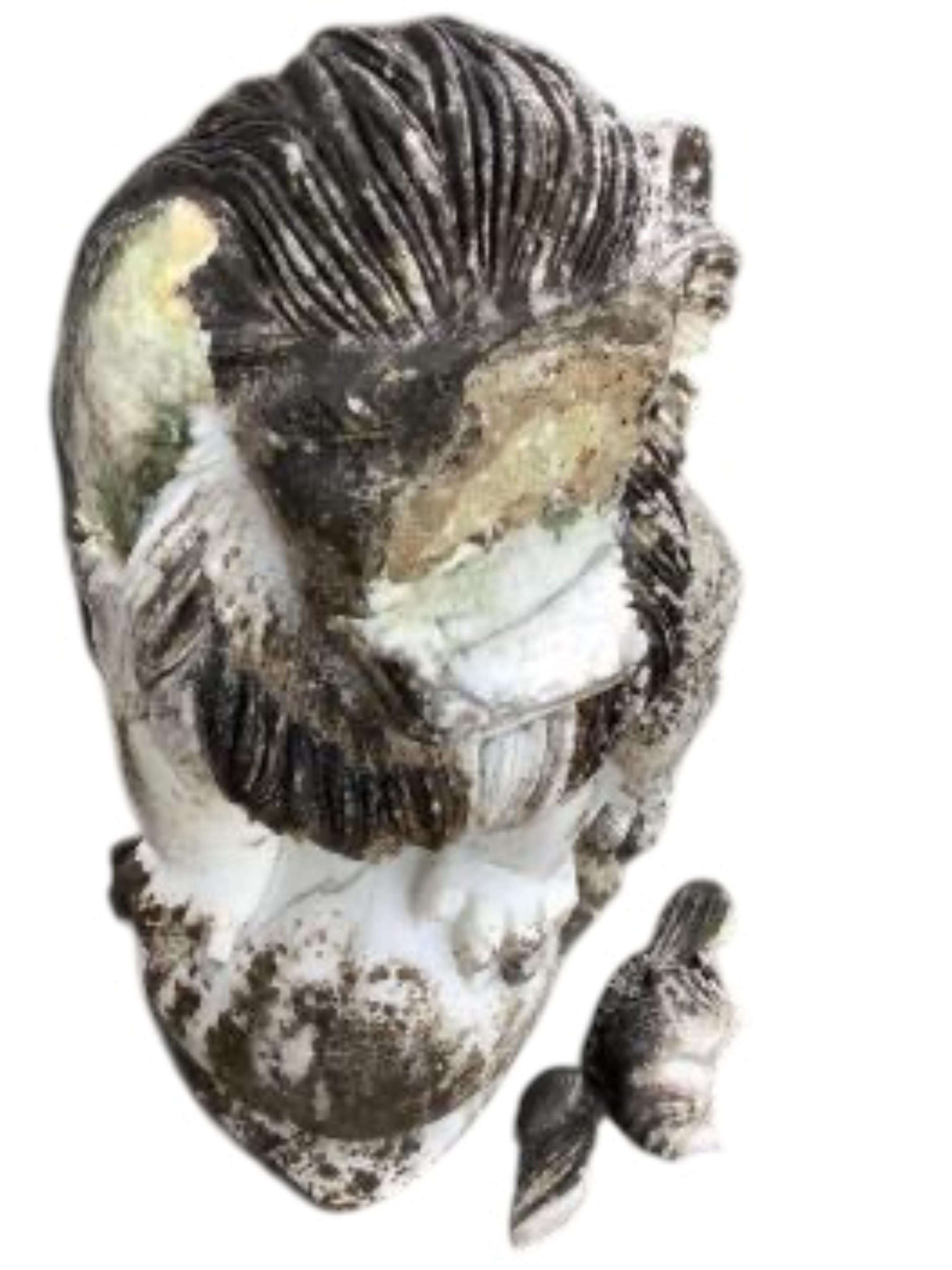 A pair of Chinese style reconstituted white marble models of kylin, (one in need of repair), height 71cm